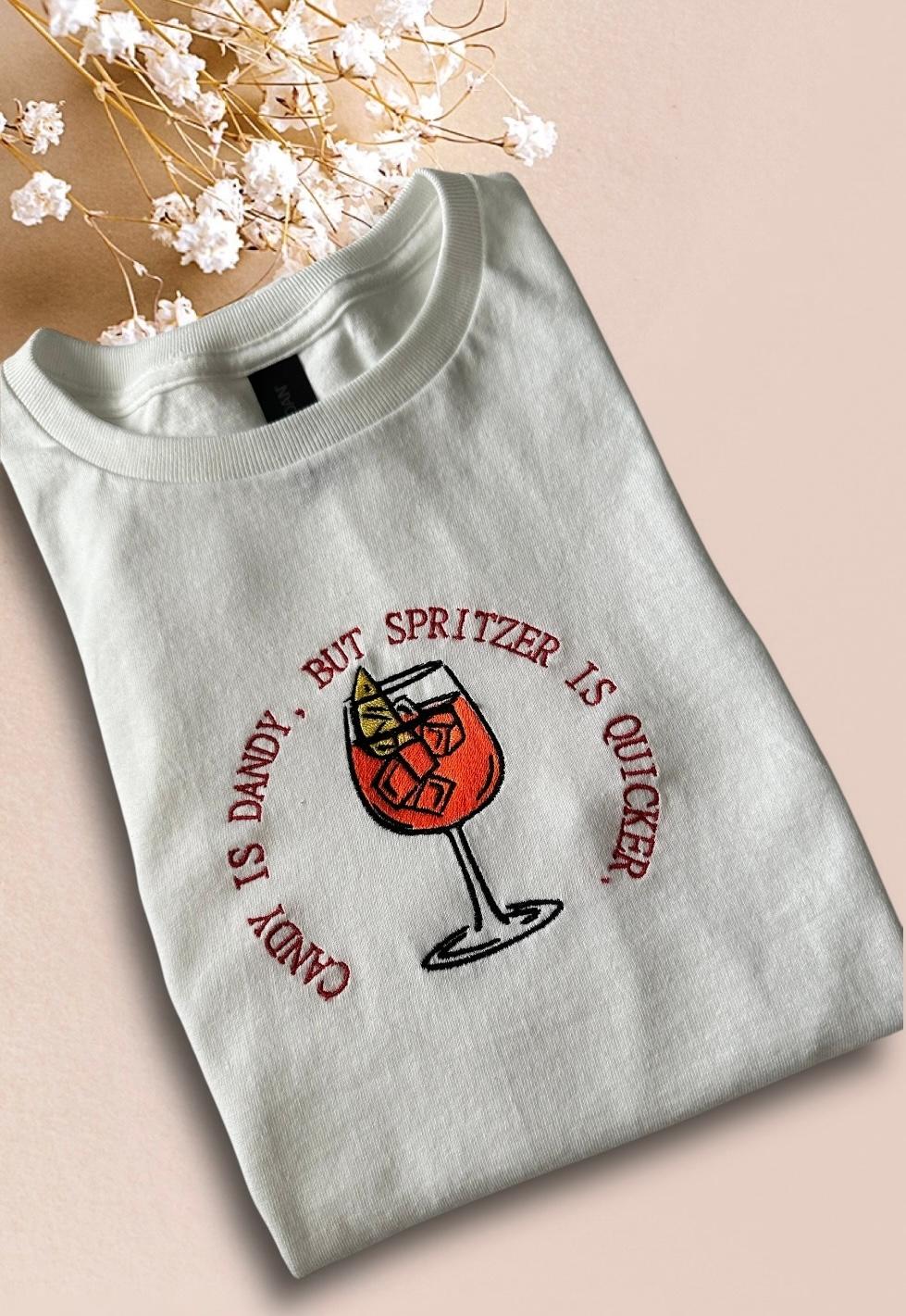 Best Summer Tee T-shirt for Aperol Spritz Fans - Embroidered quote ''Candy is Dandy, But Spritzer is Quicker'' unique rare make a statement