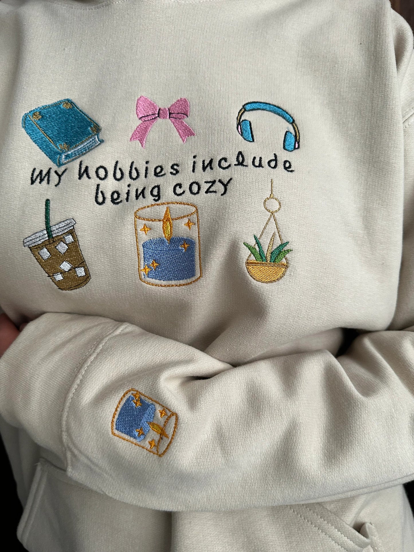 Embroidered hoodie with a quote ''My Hobbies Include Being Cozy'' with embroidered Sleeve