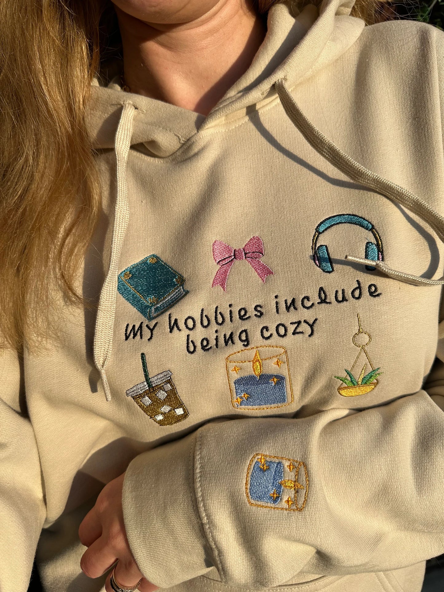 Embroidered hoodie with a quote ''My Hobbies Include Being Cozy'' with embroidered Sleeve