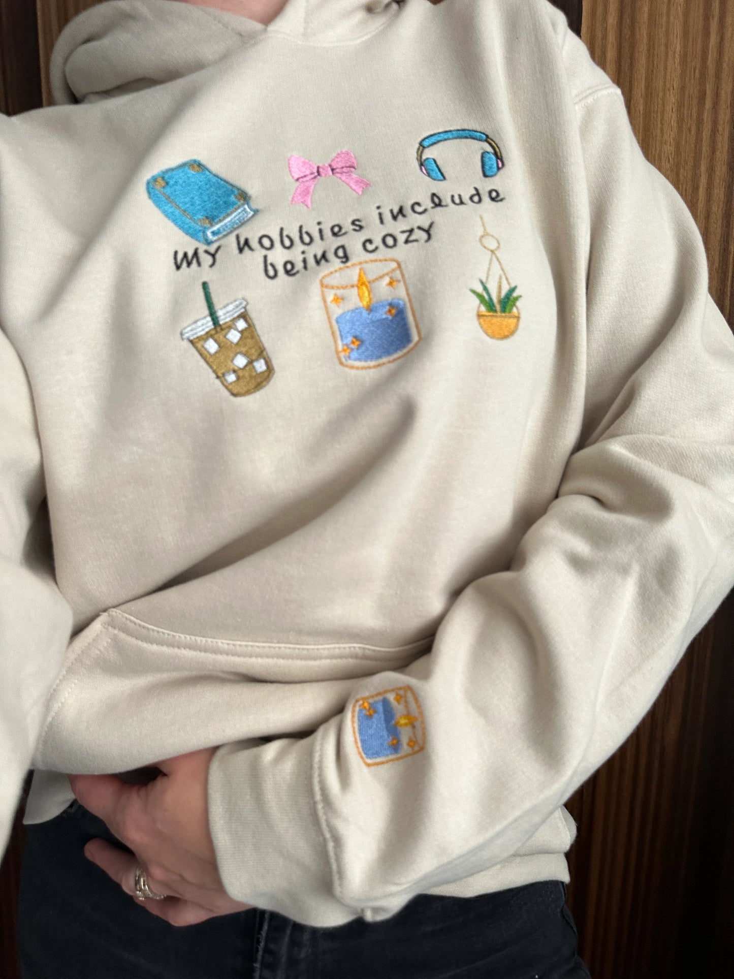 Embroidered hoodie with a quote ''My Hobbies Include Being Cozy'' with embroidered Sleeve