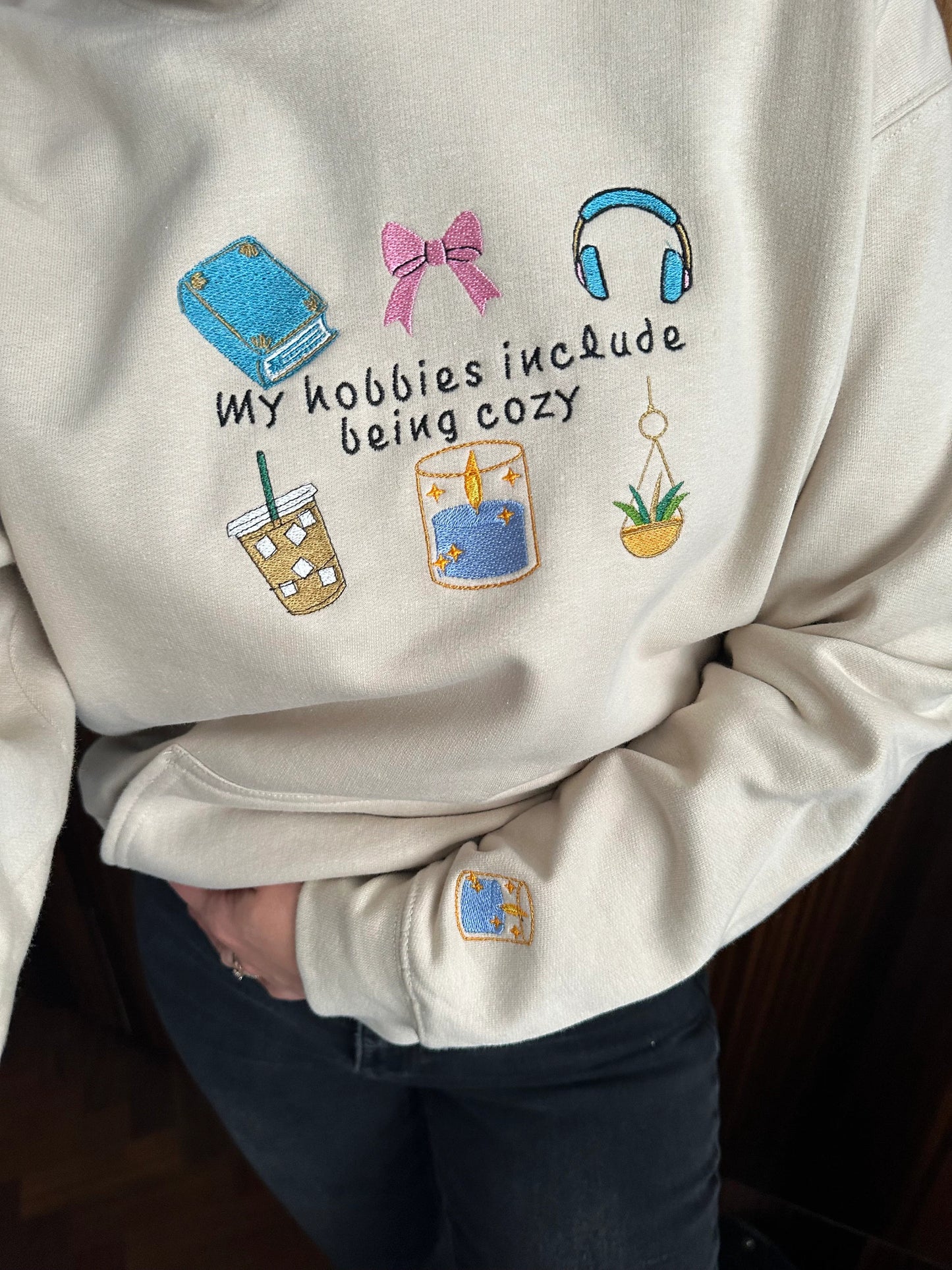 Embroidered hoodie with a quote ''My Hobbies Include Being Cozy'' with embroidered Sleeve